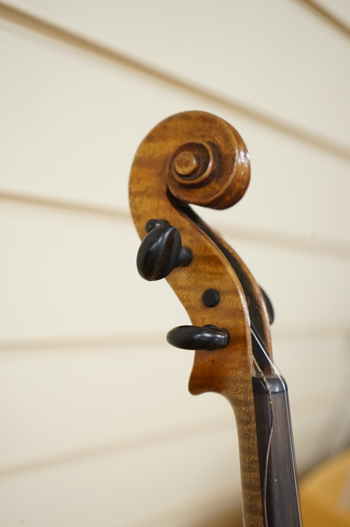 Four violins; a German Dresden violin, together with further two German violins, and a Saxony violin, three in cases or the remains of cases.